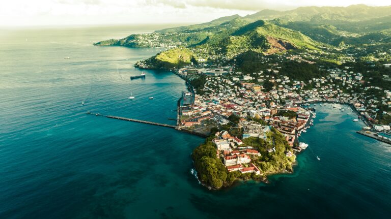 Aerial view of St. George’s, Grenada, showing the coastline, harbor, and hillside homes, representing life at a Caribbean medical school.